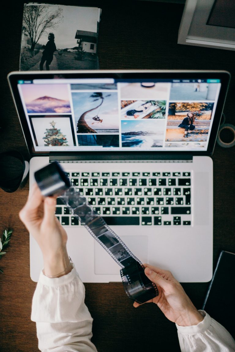 a person holding a gun and a laptop