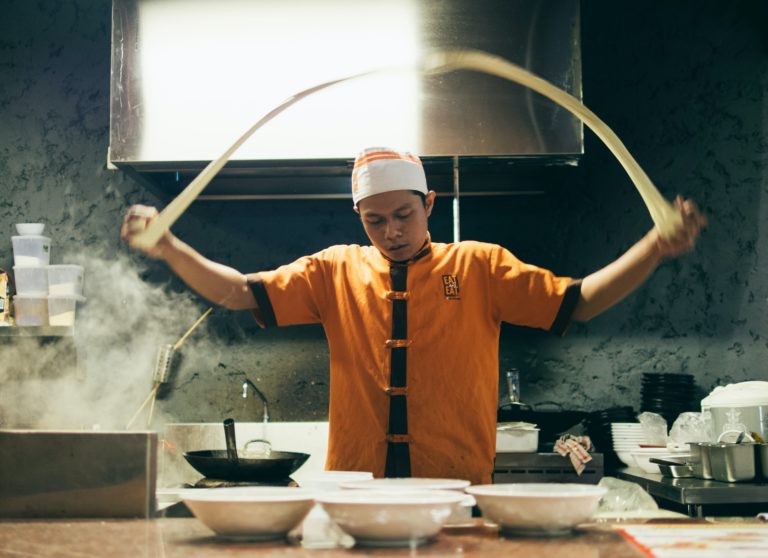 a man in an orange shirt