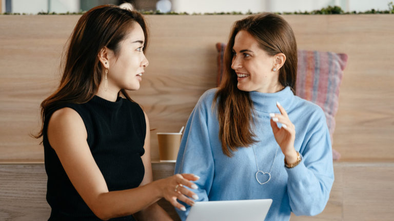 a woman and a girl smiling