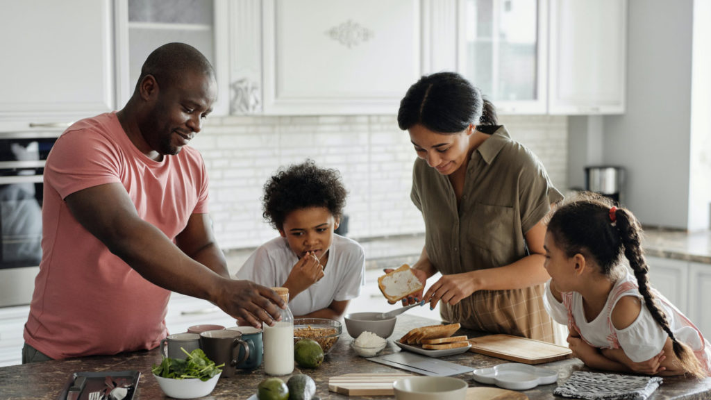 a family preparing food in the kitchen