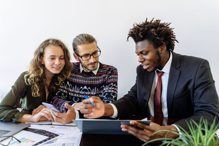 a group of people sitting around a table