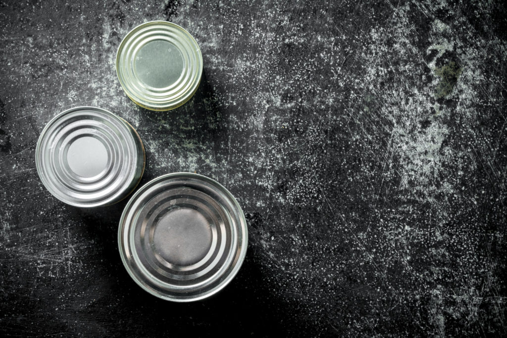 a group of glass cups on a black surface