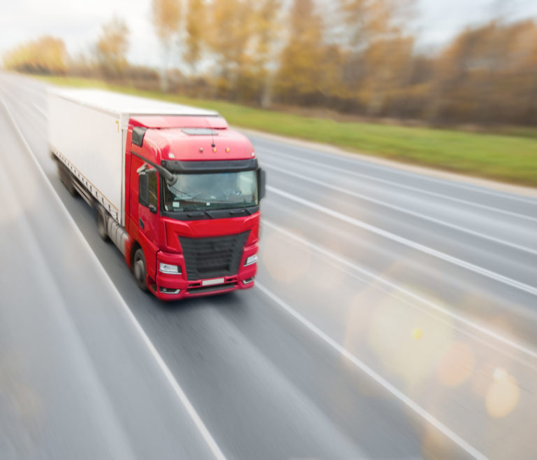 a red truck on a highway