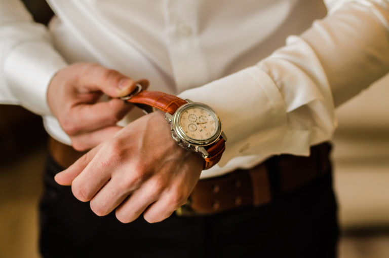 man wearing a leather watch